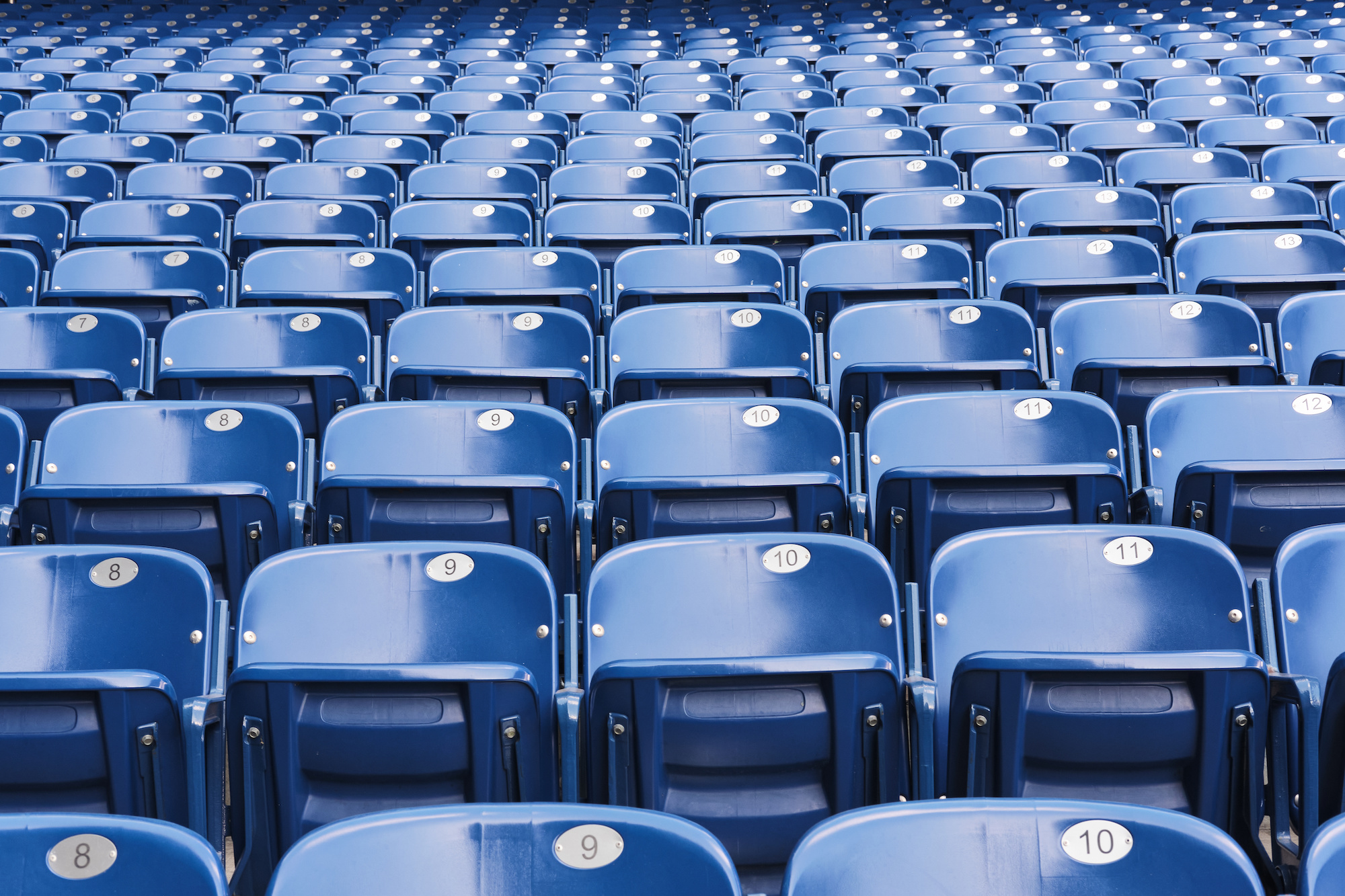 Empty blue stadium seats, empty bleachers